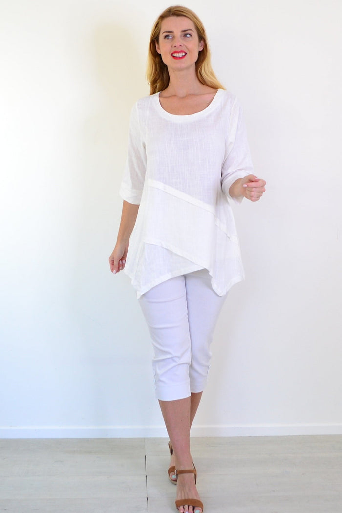 White layered linen blend tunic top by Ruby Rain, showcasing its relaxed fit and elegant design on a model.