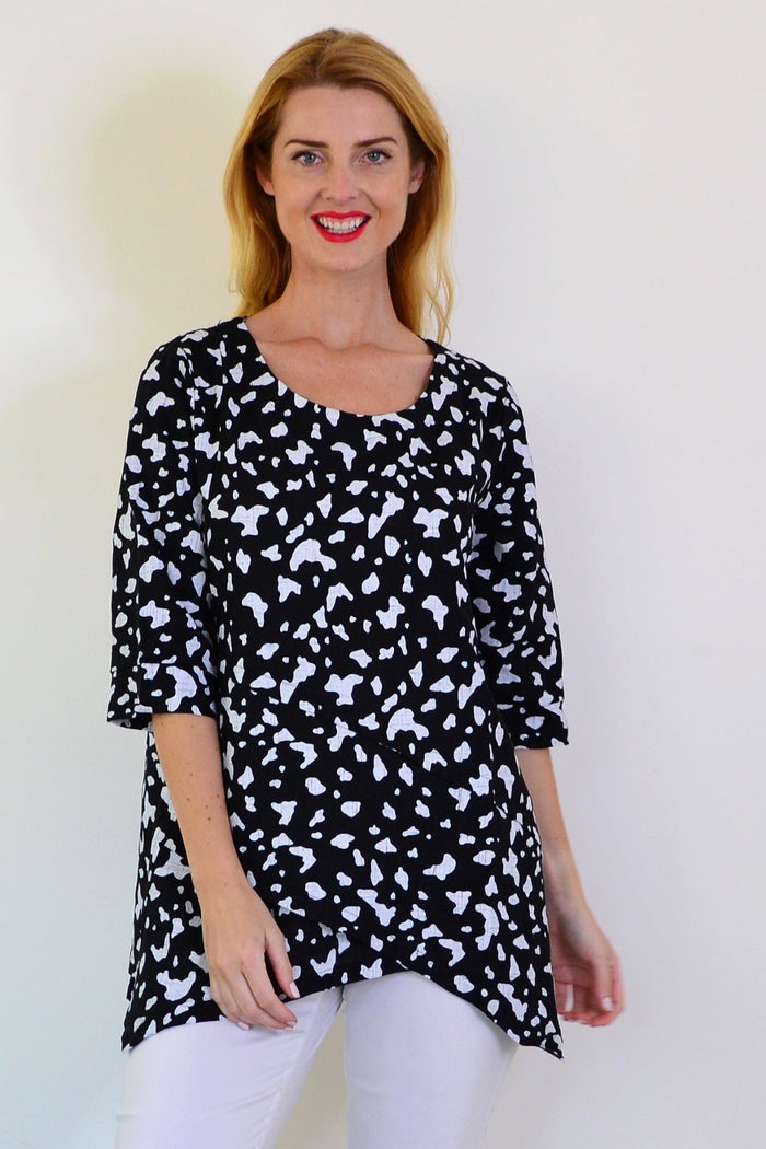 White paint splash linen blend tunic top by Ruby Rain, featuring a relaxed fit and artistic design on soft fabric.