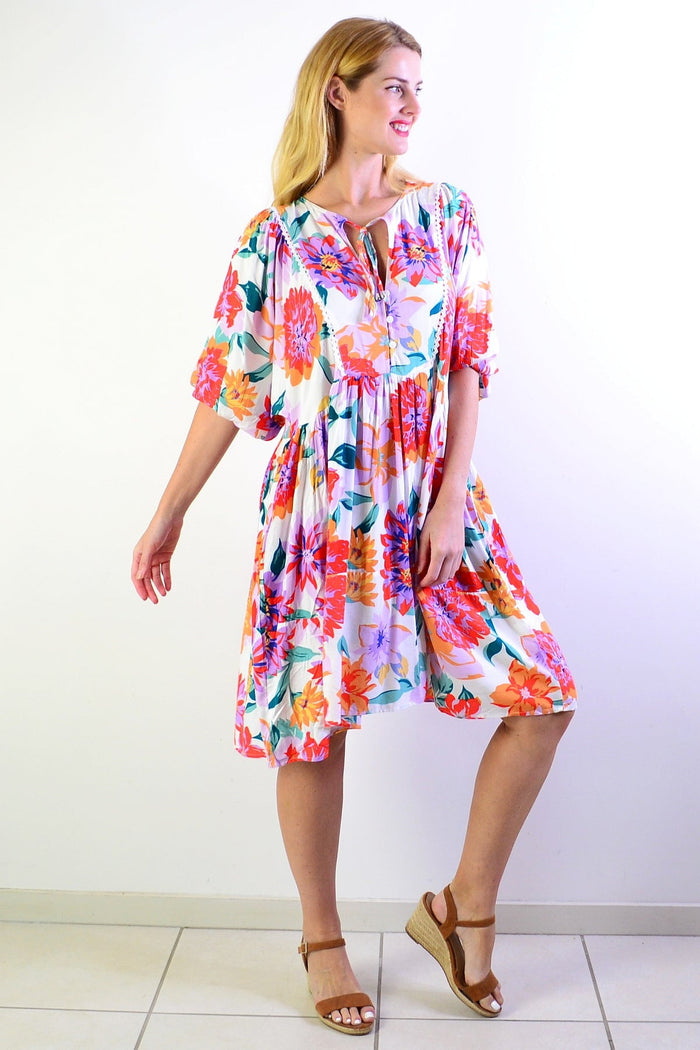 White tropical garden dress tunic by New U Collection, featuring floral patterns and lightweight fabric in a relaxed fit.