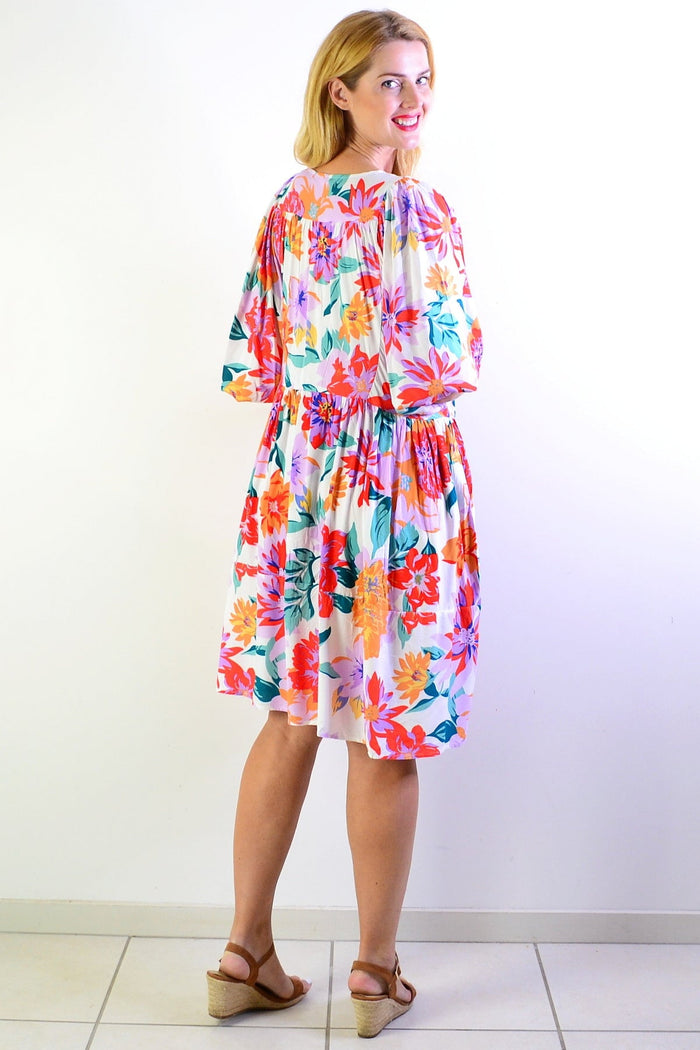 White Tropical Garden Dress Tunic from New U Collection, featuring a flowy design with tropical floral patterns and lightweight fabric.