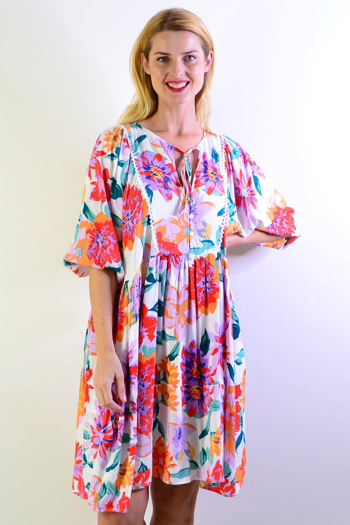 White tropical garden dress tunic by New U Collection, featuring floral patterns and lightweight fabric, perfect for warm weather.
