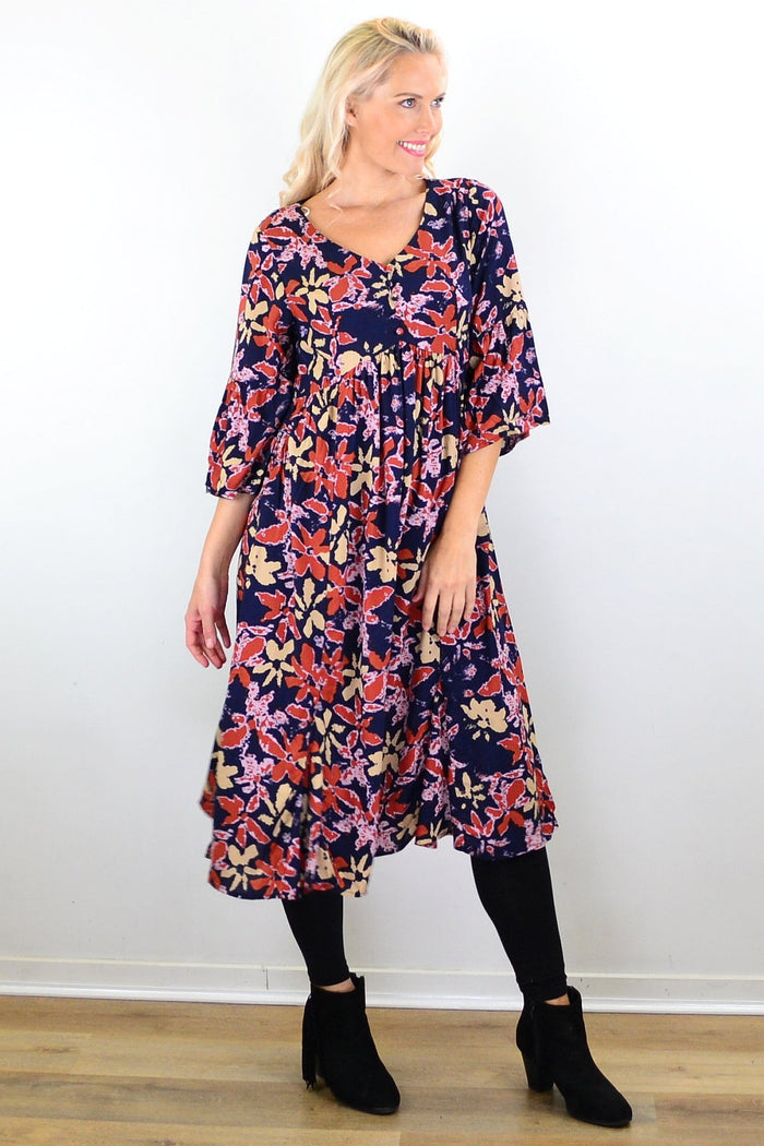 Hourglass Winter Leaves Midi Tunic Dress featuring long sleeves, a flowing silhouette, and a leaf pattern on soft fabric.