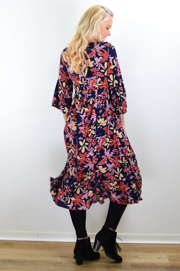 Hourglass Winter Leaves midi tunic dress showcasing long sleeves, fall leaf pattern, and relaxed fit in a stylish, comfortable design.