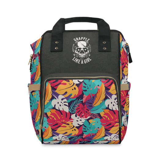 Backpack with colorful leaf pattern and black leather section on a white background