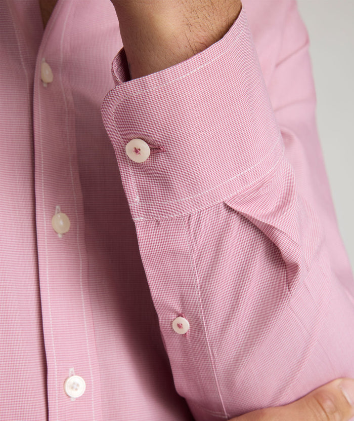 Model is wearing UNTUCKit Cadetto wrinkle-free shirt in rose wine.