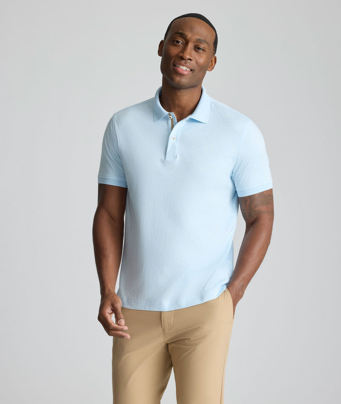 Model is wearing UNTUCKit Wrinkle-Free Damaschino Polo in heather blue.