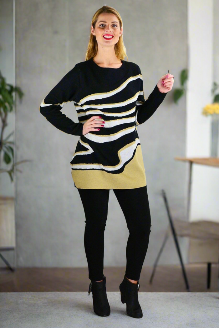 Zebra knit tunic jumper by Cafe Latte, featuring black and white zebra pattern, long sleeves, and cozy knit fabric.