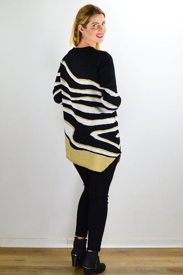 Zebra print knit tunic jumper from Cafe Latte, featuring a cozy, stylish design with long sleeves and a relaxed fit.