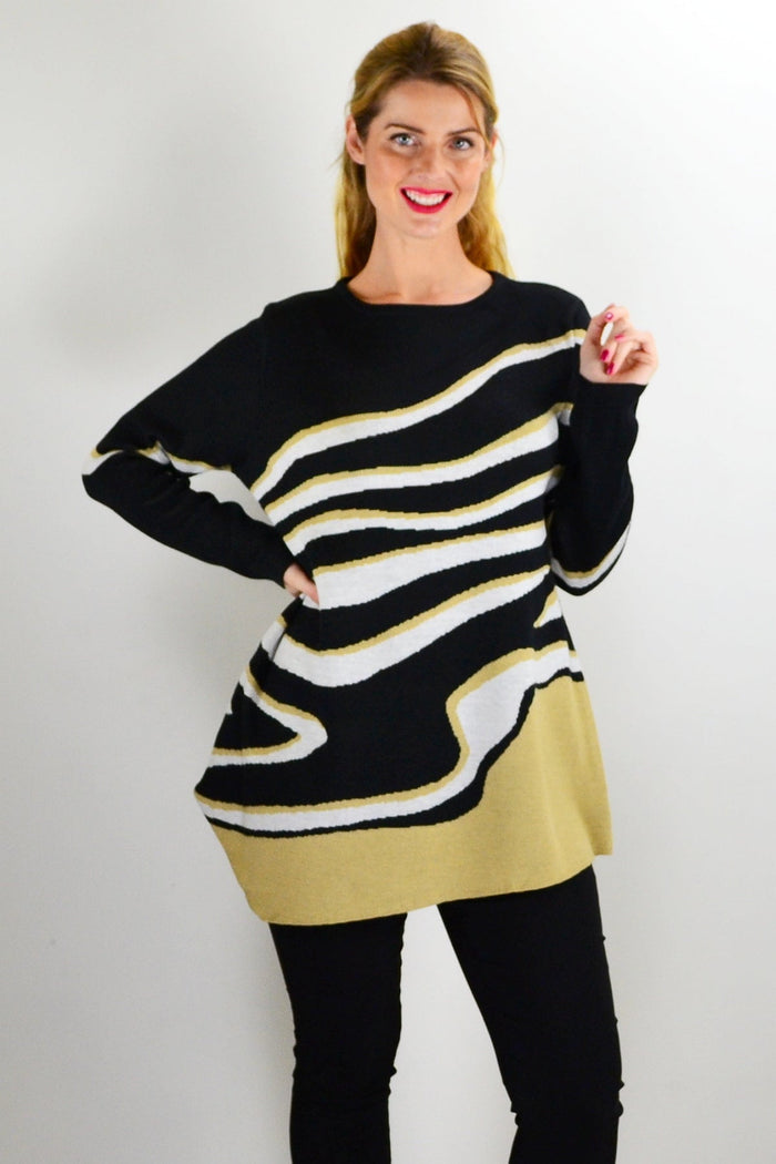 Zebra print knit tunic jumper by Cafe Latte, featuring a cozy, relaxed fit with long sleeves and a stylish pattern.
